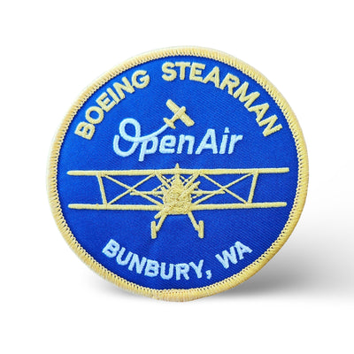 Embroidered Open Air Adventure Flights iron-on souvenir patch featuring a front-view Boeing Stearman, Open Air branding and Bunbury text.